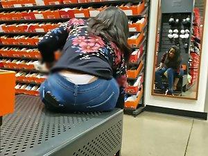 White thong peeks out of jeans when she bends forward Picture 1