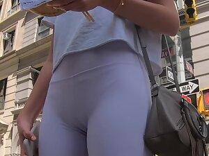 Adorable girl's cameltoe is slightly visible