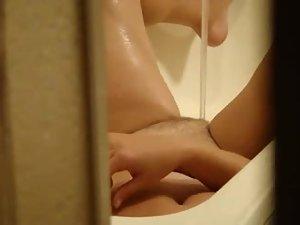 She tries to cum from water in the bath Picture 8