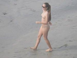 Sporty nudist girl plays frisbee on the beach Picture 4
