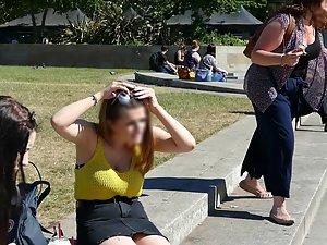 Busty girl sitting on the curb with her friend Picture 1