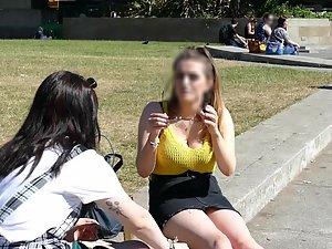 Busty girl sitting on the curb with her friend Picture 2