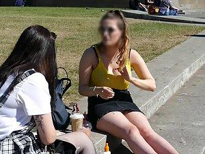 Busty girl sitting on the curb with her friend Picture 3