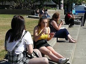 Busty girl sitting on the curb with her friend Picture 7