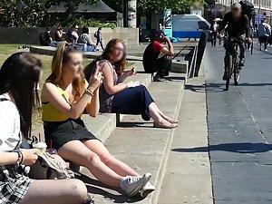 Busty girl sitting on the curb with her friend Picture 8
