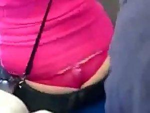 Admiring a nicely peeking pink thong Picture 1