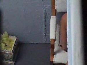 Cute chubby girl lotions up before a tan Picture 2