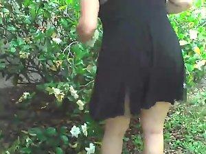 Upskirt of neighbor trimming the bushes Picture 4
