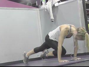 Flexible blonde stretches in the gym Picture 5