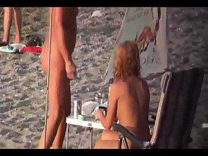 Nudist lady prepares for a dive Picture 5