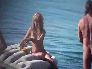 Nudist lady prepares for a dive