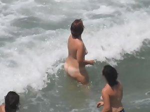 Naked girls having fun in the waves Picture 3
