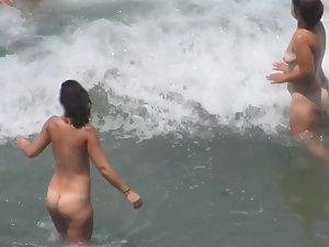 Naked girls having fun in the waves Picture 5