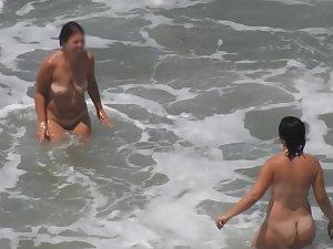 Naked girls having fun in the waves Picture 6