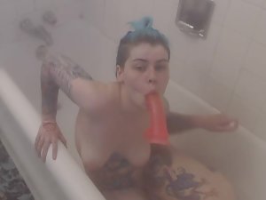 Punk girl fucks herself with rubber dildo in bathroom