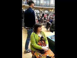 Big busty lady spied while selling hats Picture 2