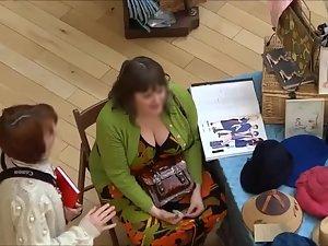 Big busty lady spied while selling hats Picture 5