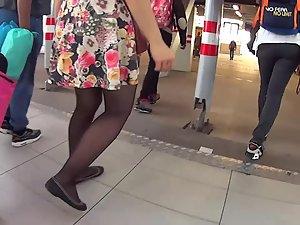 Upskirt of flowery dress on moving stairs Picture 2