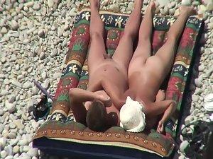 Nudist couple tanning and relaxing Picture 4