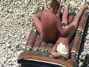 Nudist couple tanning and relaxing Picture 7