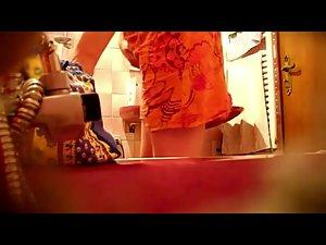 Spying a bent over wife in the bathroom Picture 2