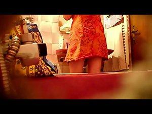 Spying a bent over wife in the bathroom Picture 3