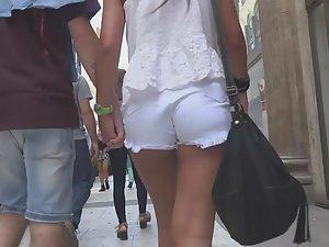 Tanned girl in tight white shorts Picture 3