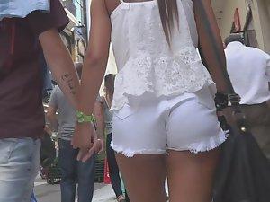 Tanned girl in tight white shorts Picture 5