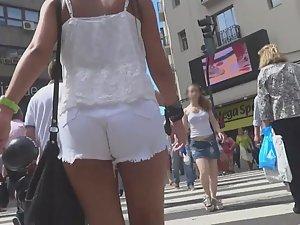 Tanned girl in tight white shorts Picture 7