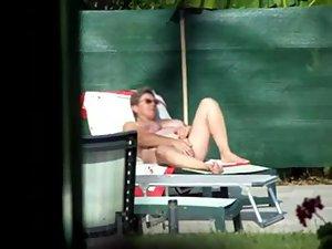 Milf thinks she's all alone at a pool Picture 6