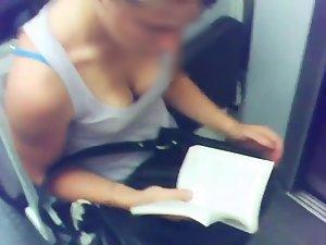 Busty teen girl reading in the train Picture 2