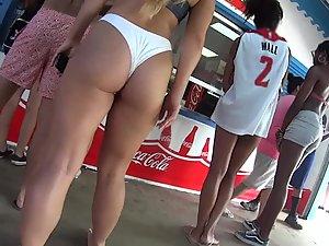 Muscular kind of thick girl looks great in white bikini Picture 5