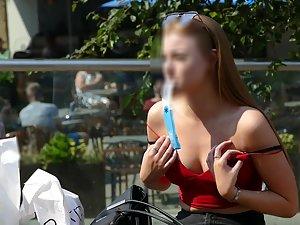 Teen beauty fixing her bra in public Picture 1