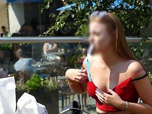 Teen beauty fixing her bra in public Picture 5