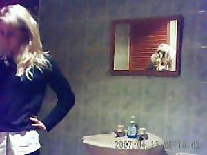 Teen girl undressing for a shower