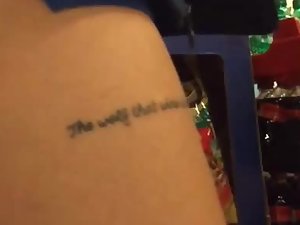 Sexy teen's tattoo mentions a wolf
