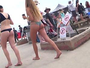 Hotties in thong bikinis walk by the beach Picture 6