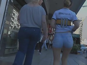 Super sexy girl walks with her big friend as bodyguard