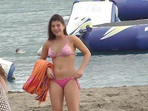 Cute girl chases friends on the beach Picture 3
