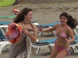 Cute girl chases friends on the beach Picture 6