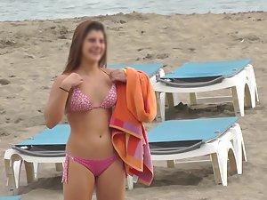Cute girl chases friends on the beach Picture 7