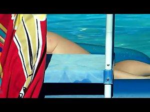 Peeping her naked floating at her pool Picture 8