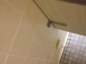Nice view of a girl pissing in a toilet stall Picture 2