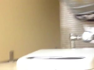Nice view of a girl pissing in a toilet stall Picture 5