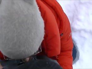 Beauty gives a blowjob out in the snow Picture 8