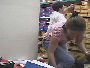 Hot big boobs of bent over girl in shoe store Picture 1