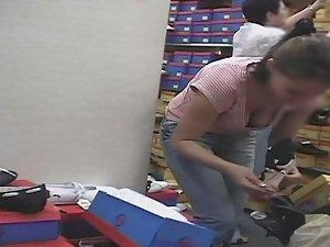 Hot big boobs of bent over girl in shoe store Picture 2