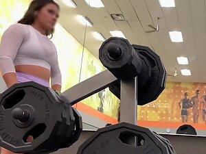 Sexy girl does deadlift with dumbbells in the gym Picture 4