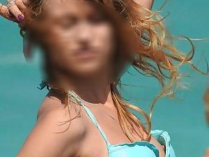 Nipple slips while they pose on beach Picture 3