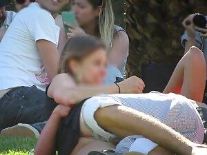 Upskirt of a horny and shameless girl in park Picture 3